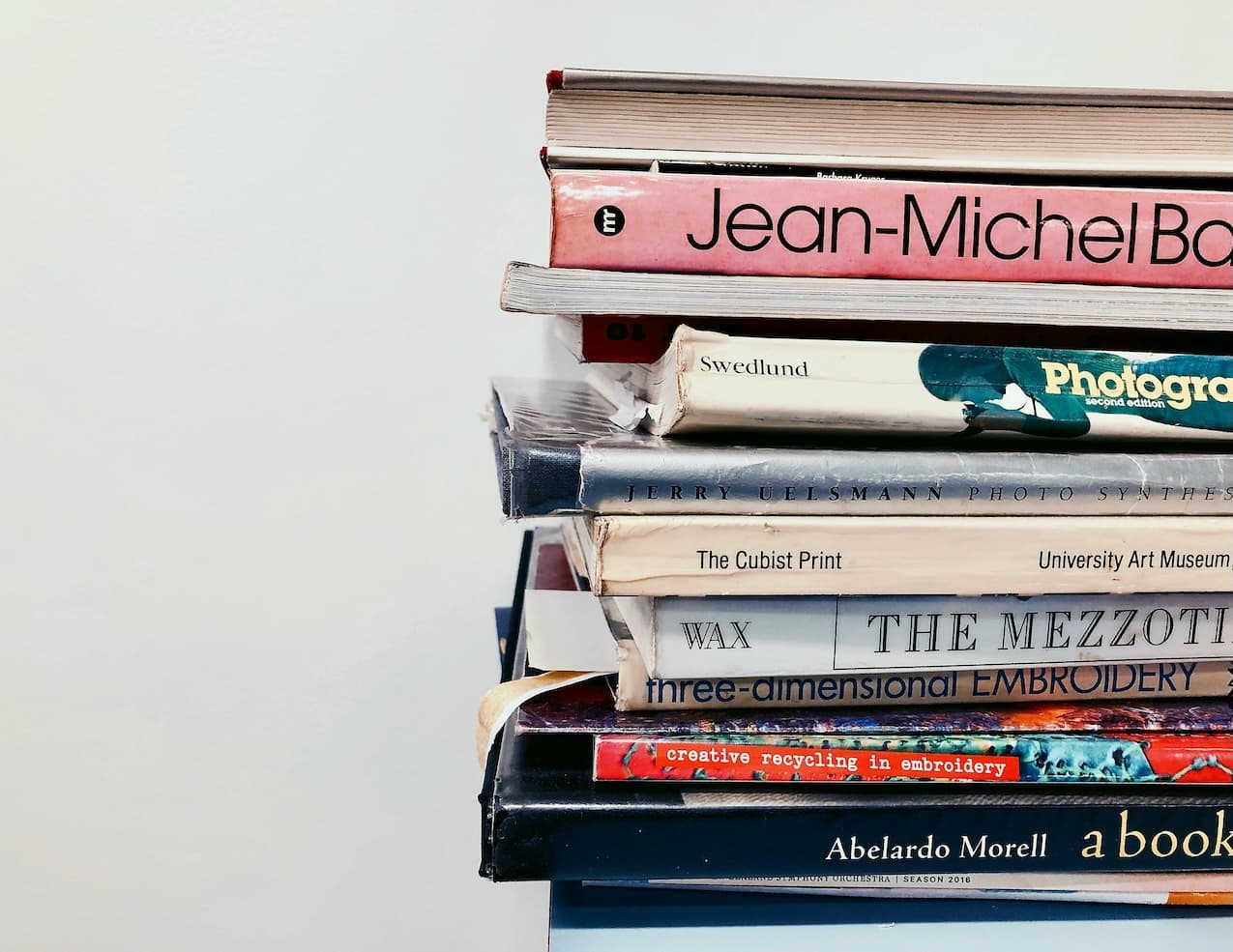 Stack of books in front of a white background