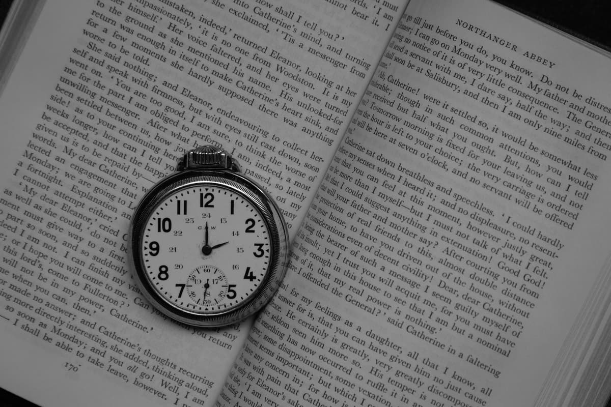 Stopwatch next to an open book