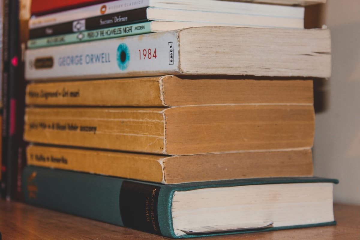 Tall stack of books waiting to be read