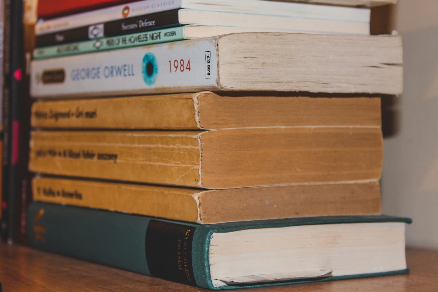 Tall stack of books waiting to be read