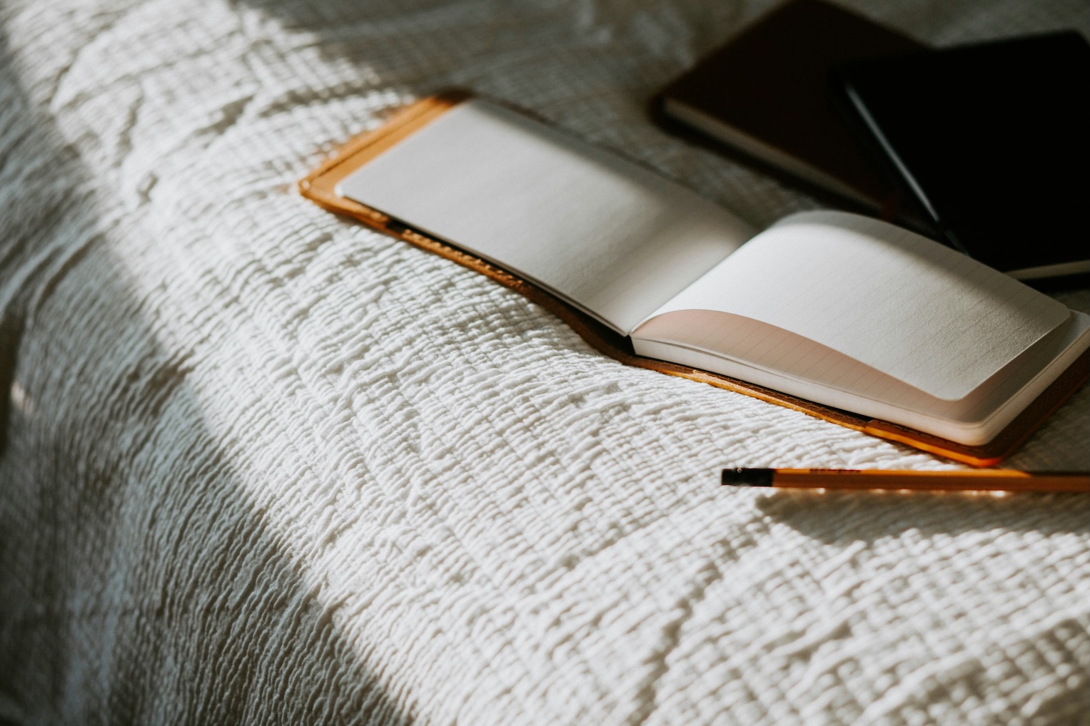 Notebook page covered in handwritten reading notes and quotes